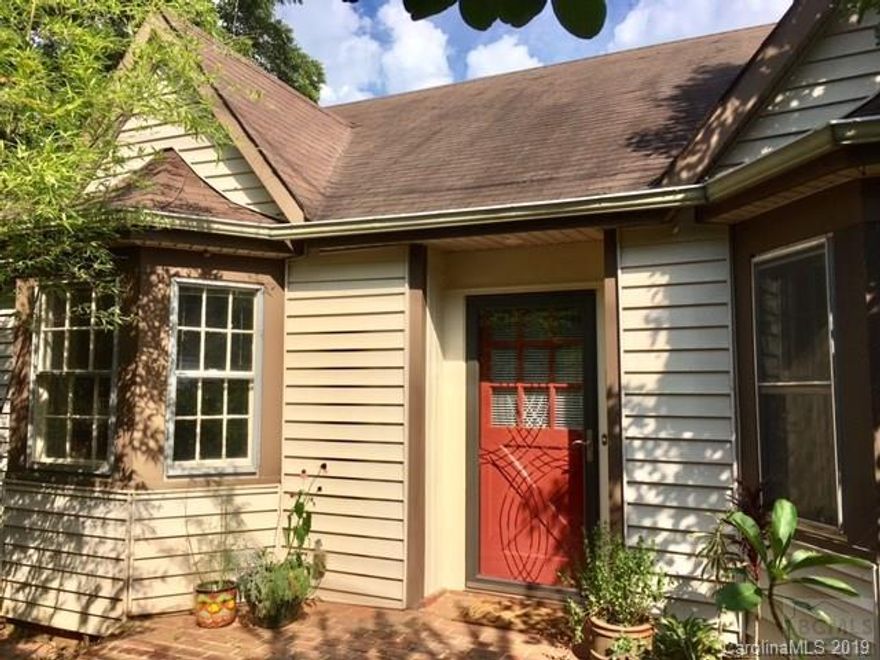 Your very own sanctuary in the city.  This home is surrounded by lush gardens including Asian pear trees, blueberry bushes and floral plantings where something is in bloom throughout the year.  The front yard is a bamboo garden with a dry creek bed running through it.  This well maintained home has new paint and beautifully finished hardwood floors throughout. Kitchen/Dining area is open with plenty of windows to let the sunlight in.  The deck offers space for grilling and entertaining. The updated interior and expansive backyard are a must see.