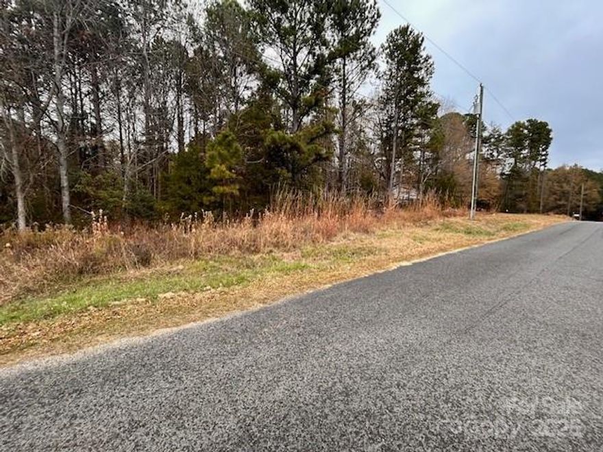 Beautiful level lot behind the Atrium Medical Center zoned HB in Norwood.   According to the planning and zoning this lot can be subdivided.  There is a possibility according to the town, that buyer could rezone this back to R10 for residential and subdivide this into 2 lots as long as their is a minimum of 10K square feet to build on.  City utilities are available through city of Norwood, tap fees required.