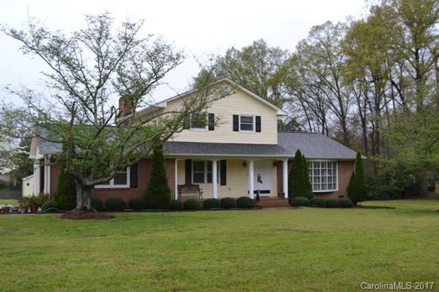 Pride of ownership shines with this home.  Large living room and dining room, kitchen has breakfast bar and double oven.  Four bedrooms, 2.5 baths and a great room with fireplace/gas logs and built-ins.  Rocking chair front porch, deck and patio with an outdoor shower.  Newer roof and gas pack, replacement windows throughout.  City close but county taxes.  Easy access to I-77, shopping and restaurants.