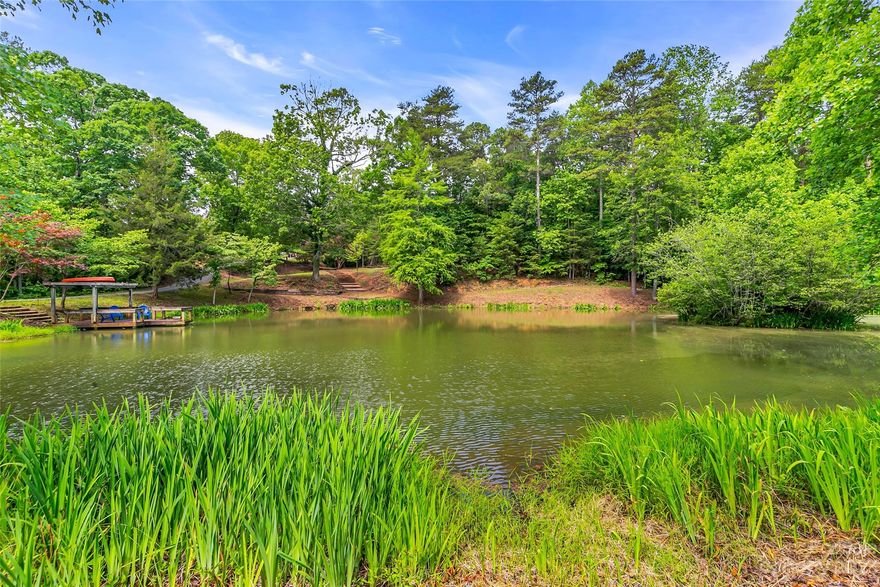 WE ARE EXPERIENCING MULTIPLE OFFERS. THERE ARE NO MORE SHOWINGS ALLOWED BY THE OWNER. ANY FURTHER OFFERS MUST BE IN WRITING AND SIGNED, AND TO US BY 5PM SATURDAY, 8-5-23. 
One property includes almost everything in the Horse Country of Polk County NC. 60 total acres, 30+ acres forested for privacy! Six horse stall barn! Riding trails thru the woods to the pond! Multiple fenced pastures! Pond, dock, island! Multiple springs on the property! They form spring runs and feed the beautiful pond! Multiple wells on property! Open pastures and fields in every direction! Pool, Greenhouse, Pergola outside of the main house! 4700+sf, 3/2/1 house with generator, Underground power and utilities! The barn is in great shape and ready for your horses! The pond and surrounding area is in great shape! Some of the fencing around the property is going to need a little work! NO drive ins / NO drive bys! Do not disturb tenants! Agent / Seller must accompany!