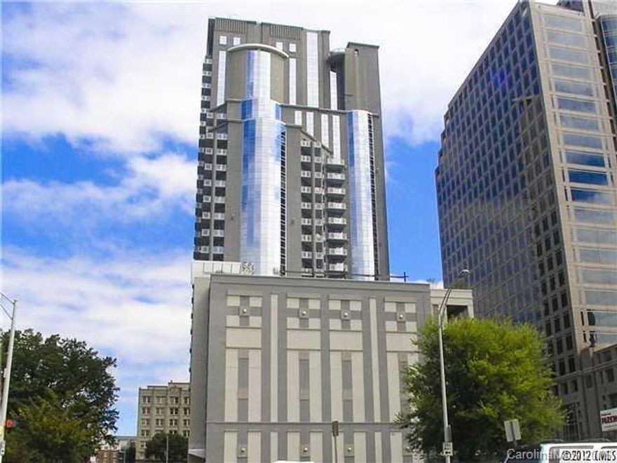 Come be a part of a vibrant center city. TradeMark is a sophisticated bldg in the heart of it all!  This 1 level loft features 10' ceilings, expansive windows w a spectacular view from the 14th flr. Relax @ the Romare Bearden Park. WALK to see the Knights swing a bat, the Panthers to Keep Pounding OR the Hornets stay alive at the hive! Enjoy the balcony year round. Walk to restaurants, bars, galleries, music & performing arts venues++ This sleek property offers a lifestyle that you will love!