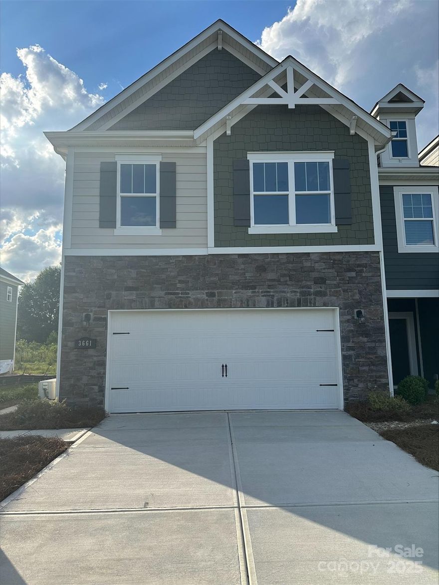 Welcome to the Catawba! This beautiful former sales center home has had the front exterior converted to a garage & comes as-is with a 1-year 3rd party warranty. Walk in from your private side entrance to an open and inviting space. You'll be greeted with a spacious kitchen, complete with an island, stainless steel appliances, including a French door fingerprint resistant refrigerator & custom quartz contertops for more space to cook and entertain. With our open floorplan, you have easy access to the family room to enjoy conversation and quality time. With enough space to easily fit a sectional, coffee table and other furniture, the family room is the perfect spot to unwind. All the windows have been thoughtfully adorned with custom model window treatments to add an extra level of elegance. The main level is finished with custom & easily maintainable model home EVP flooring. Finishing the main level is a private back patio, perfect for morning coffees or entertaining. Take the staircase to the upper level, where you'll find the spacious owners bedroom with ensuite to ensure privacy and comfort. The owner's bedroom has tons of natural lighting, a gorgeous tray ceiling, LED lighting and custom designer overhead light. The owners bathroom is spacious and elegant with a tiled shower, dual vanity & linen closet. Finishing the owner's suite is an expansive walk-in closet.  You will also find two additional bedrooms, perfect for guests or home office. The secondary bath is easily accessible to the additional bedrooms to ensure everyone is satisfied. The loft adds for additional entertaining space! Finally, you get to enjoy the ease of same-level laundry access with included full-size washer & dryer to make laundry a breeze!