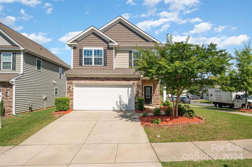Large corner lot! This freshly painted, 2016 home is ready for its new owners! As you enter, you will notice the beautiful hardwood floors that flow throughout the main level. The kitchen has plenty of space and features granite countertops, stainless steel appliances, and a tiled backsplash that ties it all together. The large breakfast bar off the kitchen opens up to the living room with a granite surround fireplace and plenty of natural light. Upstairs you will find a large primary suite with walk-in closet, dual vanities as well as tiled shower and garden tub. 2 additional bedrooms, an additional bathroom, and loft that could be used as an office complete the upstairs. Out back you will find a patio, perfect for enjoying the outdoors. Tesla charger in the garage will remain! Don’t forget about the award-winning Fort Mill Schools, unbeatable amenity center, and nearby athletic fields!!