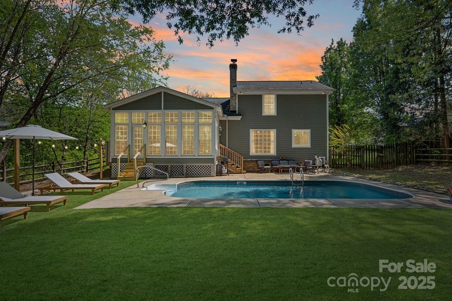 Welcome to your own private retreat in the heart of Mooresville! This updated 3 BR, 2.5 BA home sits on one of the largest, private lots in the neighborhood. Home features a dreamy backyard oasis with an in-ground pool (new pump, liner, and turf area!), large sunroom overlooking the pool and backyard, and fresh landscaping. Inside, enjoy vaulted ceilings, LVP flooring throughout, neutral paint, and a cozy brick fireplace. The main-level primary suite boasts a new spa-like bath with freestanding tub and luxury shower. Upstairs offers a versatile loft/flex space, two additional bedrooms, and full bathroom. Kitchen includes SS appliances, pantry, and coffee/beverage bar. Minutes from Mooresville Golf Club, top-rated MGSD schools, parks, shopping, and dining! This one checks all the boxes!