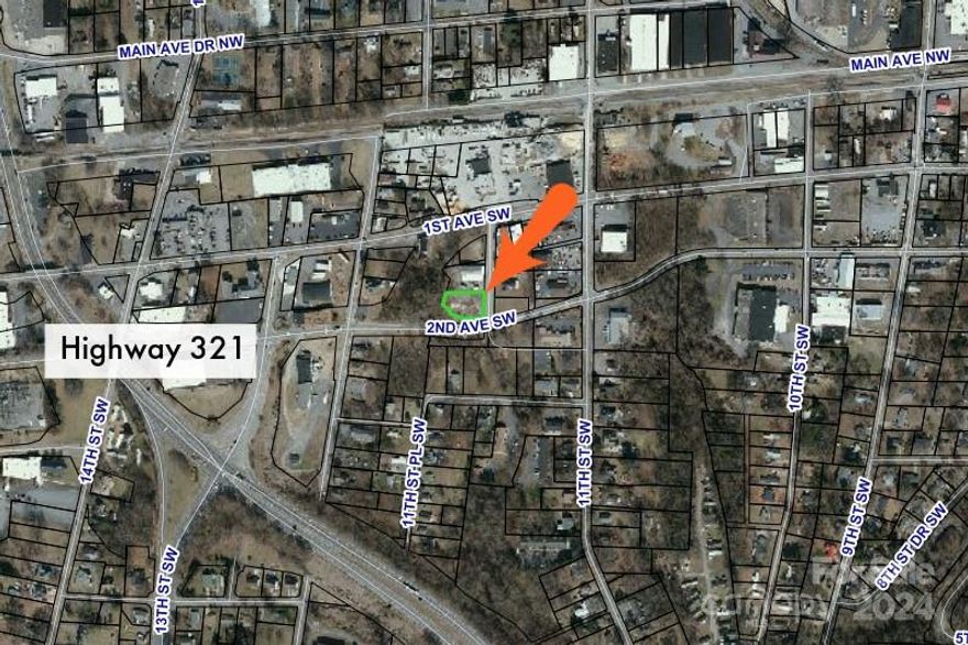 Commercial corner building lot near Downtown Hickory. DOT will be changing the flow of traffic in this area in the next couple of years and this site will be a prime location. This lot is mostly level and it would pretty easy to build on it.