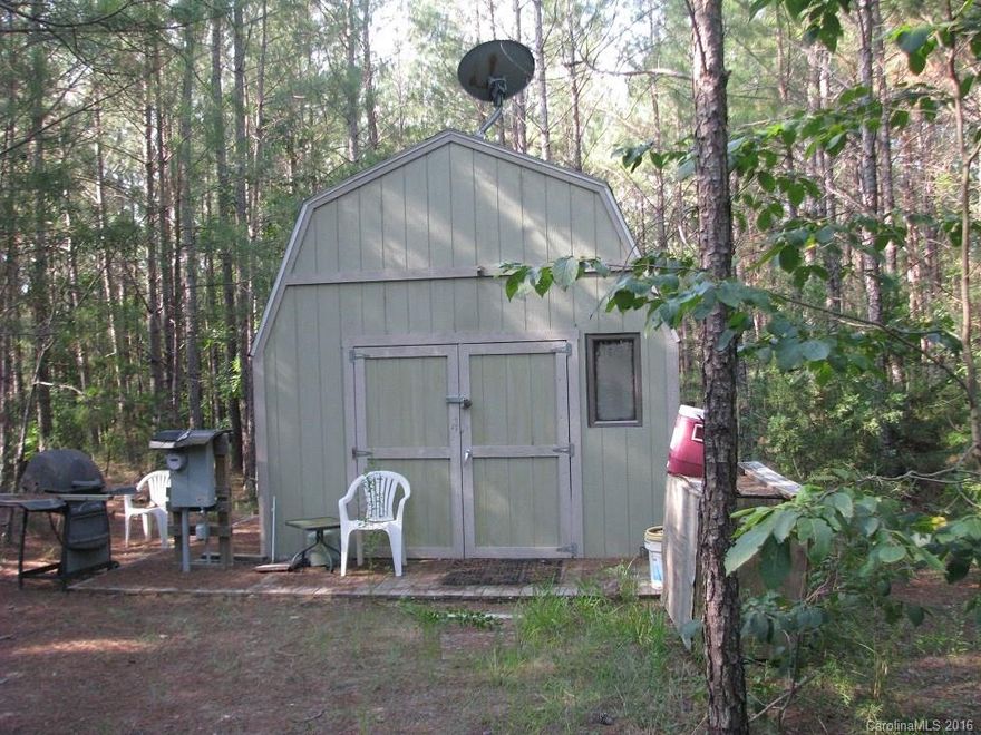 Ideal Hunting Property with small 1 room cabin equipped with underground power.  Rolling timberland has good planted pines ready to thin on the ridges and nice shady hardwoods on the slopes and along the streams.  Small storage bldg and short access drive into property.  ATV trail runs thru pines and hardwoods to back hilltop.
Over 1300 feet pave frontage on Lewis Store Rd about 2 miles from US Hwy 321.  Quite rural area of Northern Fairfield County.  Easy access by 4 lane roads to I-77.