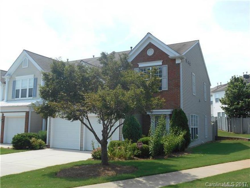 Executive End Unit Ballantyne townhome. 3 bedrooms and 2.5 baths with 2 car garage and beautiful fenced in patio out back. Sweet hardwoods down, spacious bedrooms up. Big Master suite with walk in closet and garden tub. New paint and new carpet. Must see back patio setting. Functional open floor plan, great room with fireplace, dining room, breakfast area. Neighborhood amenities include pool, clubhouse and tennis courts. Great schools. Close to shopping and restaurants .