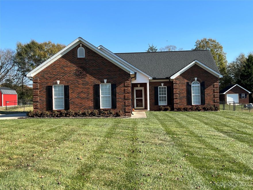 A Must See!!  Well maintained, immaculate brick ranch with beautiful, manicured lawn awaits new homeowners.  Enjoy winter evenings enjoying gas logs in living room. Many upgrades.  Prefinished hardwood floors, Split bedroom floor plan, granite in kitchen and both bathrooms as well as custom vanities.  Patio is perfect with permanent gas line for grilling as much as one may desire.  26 x 30 detached wired workshop with insulated garage door as well as lean to for extra storage.  Fenced in back yard  also.  Country living in a wonderful neighborhood with no HOA.  Convenient drive to 485 as well as shopping, medical offices, and schools.