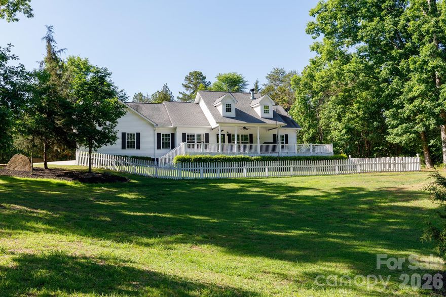 Beautiful single-story ranch home on 10 private, wooded acres in York County, SC—a rare opportunity to own a peaceful country retreat with modern upgrades. Set atop a gentle hill, this pristine, move-in ready home offers scenic views, exceptional privacy, and a long, winding paved driveway past boulders and dense forest leading to a welcoming front porch. A truly special property that stands out in York County. Featuring 3 bedrooms and 2 full bathrooms, the home offers a bright, open layout ideal for everyday living and entertaining. Built with durable 2x6 construction for energy efficiency, highlights include a heat pump HVAC system, granite countertops, cultured marble in the primary bath, and well-maintained finishes throughout. Additional features include a luxurious primary suite with double sinks, soaking tub, and two oversized walk-in closets, plus fenced yard areas, whole-house water filtration system with softener, wired workshop/shed, carport, and generator-ready setup. The usable wooded acreage offers endless possibilities—ideal for homesteading, hobby farming, gardening, recreation, or small livestock. Enjoy quiet country living just minutes from downtown York and popular local destinations. A rare blend of privacy, land, and convenience.