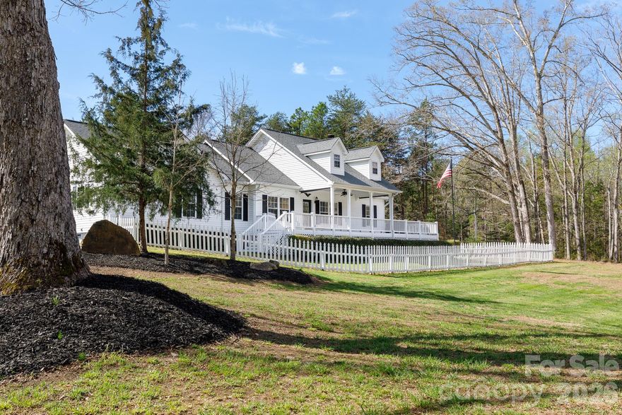 Beautiful single-story ranch home on 10 private, wooded acres in York County, SC—a rare opportunity to own a peaceful country retreat with modern upgrades. Set atop a gentle hill, this pristine, move-in ready home offers scenic views, exceptional privacy, and a long, winding paved driveway past boulders and dense forest leading to a welcoming front porch. A truly special property that stands out in York County. Featuring 3 bedrooms and 2 full bathrooms, the home offers a bright, open layout ideal for everyday living and entertaining. Built with durable 2x6 construction for energy efficiency, highlights include a heat pump HVAC system, granite countertops, cultured marble in the primary bath, and well-maintained finishes throughout. Additional features include a luxurious primary suite with double sinks, soaking tub, and two oversized walk-in closets, plus fenced yard areas, whole-house water filtration system with softener, wired workshop/shed, carport, and generator-ready setup. The usable wooded acreage offers endless possibilities—ideal for homesteading, hobby farming, gardening, recreation, or small livestock. Enjoy quiet country living just minutes from downtown York and popular local destinations. A rare blend of privacy, land, and convenience.