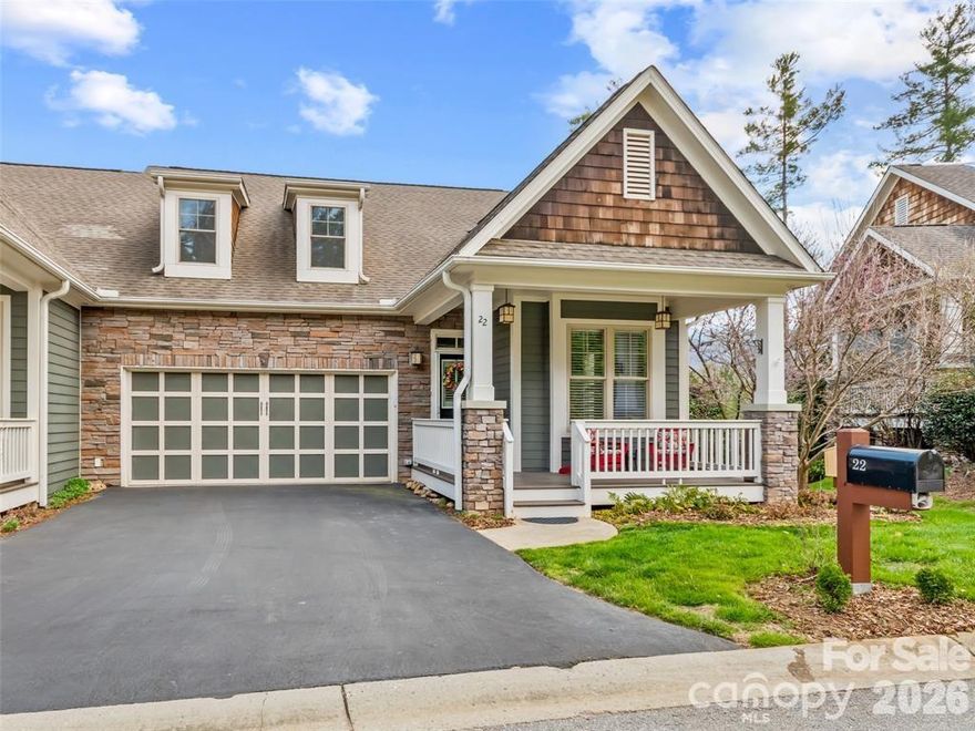 Bright and Sunny end unit in a gated section of  desirable Biltmore Lake. Lifestyle community with private 62 acre lake, miles of walking trails, non motorized boating, clubhouse, tennis/pickleball and more! Lock and leave home loaded with upgrades with open floorplan, 9'+ and cathedral ceilings, stone gas FP and year round views! Main level primary suite with walk in closet plus en suite full bath with double sinks, walk in tiled shower and garden tub plus an additional office/bedroom on main. Open kitchen w/ Granite countertops, stainless appliance package and eat in bar. Guest bedroom on lower level plus flex room. Plenty of storage, 2 car garage. Large covered porch, 2 rear decks with Trex flooring. Largest plan available!