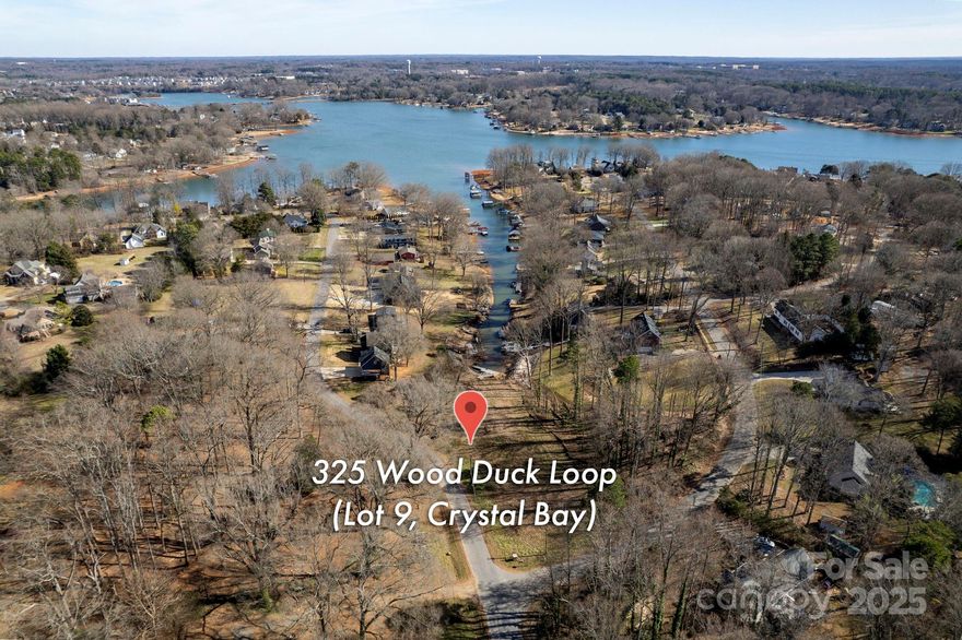This waterfront lot in a lake access community with minimal restrictions is ready for your build! Lot 9 has been perc tested and a septic improvement permit for an off-site septic system (easement on adjacent lot 10) is underway for a 4-bedroom home. Large, 0.69 acre, mostly cleared lot. No mobile homes, only stick-built homes, yet the minimum size to build is only 800 heated square feet, which gives you great flexibility if you want a smaller lake house. Great opportunity with both your own floating dock on Lake Norman, and in addition, a community lake access is close by. Tucked away in a quiet community, yet convenient to Mooresville shops, restaurants, and marinas. Come build your dream home!