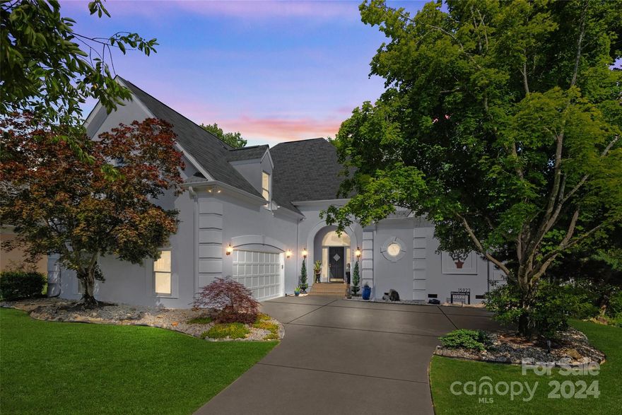 Lake front Beauty! If living in a highly regarded development sounds appealing, then put this opportunity in River Pointe at the top of your Charlotte tour list. This 4-bedroom, 2.5-bathroom Mediterranean-style charmer evokes yard parties and breezy open windows.. The location is easily driveable to shopping and dining options and schools. Enjoy amazing views of Lake Wylie. Cross the threshold into a warm welcome that includes a grand entryway, hardwoods throughout, stylish lighting, neutral decor, vaulted ceilings, and a gas fireplace in the living room. The attractive island layout of the kitchen sets the stage for culinary achievement.. The highly functional main-floor primary bedroom includes recent updates, a walk-in closet, and a private bath with a walk-in shower. The other three bedrooms, situated above the ground floor for privacy, are unique and quiet. Attached two-car garage. The deck is perfect for relaxing. Open the front door to a pleasant new life here in Charlotte