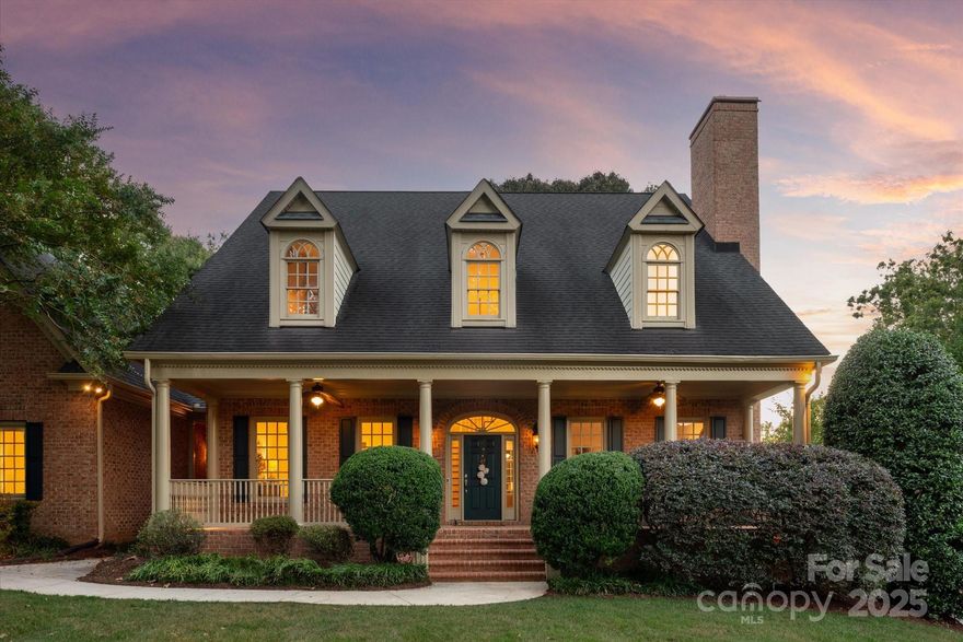 True southern gem with 5 bedrooms + bonus room in popular Providence Downs community! This home oozes southern charm with features including a lovely front porch and covered back porch, extensive crown molding, designer lighting and private garden like backyard with large paver patio with decorative outdoor lighting, Koi Pond, plus a built in outdoor grill. Great floor plan features a primary suite on main with hardwood floors + 4 additional oversized secondary rooms each with a walk in closet and a HUGE bonus room with separate staircase + a loft. Kitchen features a gas cooktop and walk in pantry + a beautiful 2 story breakfast area featuring a wall of windows. So many great features in this beautiful home and wonderfully maintained! Exterior painted in 2024! Interior painted 2025, Newer HVAC system (main and upper floor: 2020). Newer Hot Water Heater (2023). Zoned for Marvin Schools. Easy access to community walking trails and amenities!