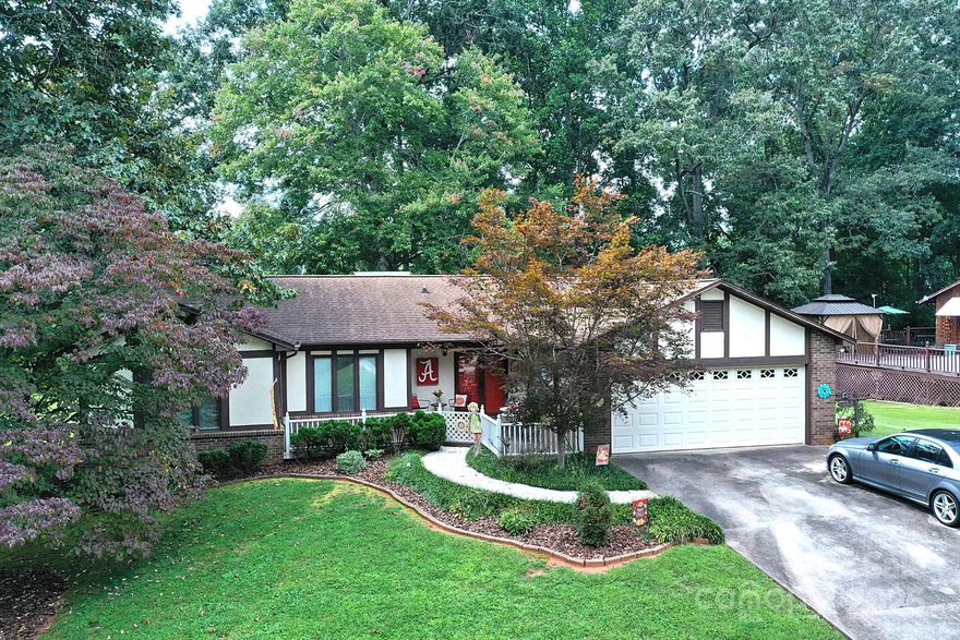 Welcome to this beautifully maintained  three bedroom two and half bath home . This home boasts of a wood burning rock fireplace and beautifully beamed ceilings in the Living Room. Right off from the Living Room is a oversized deck perfect for outdoor gatherings.  Modern Kitchen with dishwasher, ample cabinet space and a built in coffee bar. This home is thoughtfully designed for everyday living, with lots of living space for hosting friends or relaxing with family. This home offers everything you need and more in a well balanced floor plan, ideal for families or anyone seeking extra living space. The spacious attached garage provides secure parking, extra storage and direct access to the home.