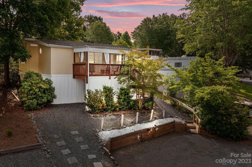 Here is your chance to live in this lake property that feels like you are in the mountains. It is a park model home with room addition in a gated community. 2 bedroom, 1 bathroom, front deck, rear patio, gravel parking. Property is located in Badin Shores Resort. Amenities include pool, basketball and volleyball courts, playground, 18 holes mini golf, horseshoe area, remote control vehicles game area, boat ramp, beach area, clubhouse, picnic areas and fishing pier. You can also ride golf carts on streets. HOA fees include clubhouse, all the amenities, water and sewer.

This home is allowed for short term or long term rent. The cozy porch will have you sipping your favorite beverage while feeling the summer breeze.  It's pretty much turn key as most furniture stays with a few exceptions and personal items. You will want to add this to your shopping list.