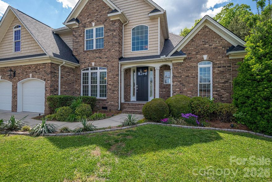 Take a look at this stunning estate located in the prestigious gated community of Old Course in Cramerton. Perfectly positioned along the 5th fairway of Cramer Mountain Country Club, this stately home offers exceptional curb appeal and one of the most impressive architectural designs in the neighborhood. As you turn onto St. Andrews Court, the home’s presence immediately captures your attention.

Step inside the grand foyer and you’re welcomed by beautiful hardwood floors, soaring vaulted ceilings, and an elegant staircase. The spacious great room features vaulted ceilings, a handsome gas-log fireplace, and an open-concept layout ideal for both everyday living and entertaining.

The kitchen is truly a culinary dream, centered around a large island with classic chandeliers, granite countertops, a deep sink with disposal, and bar seating for gathering with family and friends. Custom white cabinetry provides abundant storage and perfectly complements the stainless steel appliance suite. Just off the kitchen, a cozy keeping room/den with its own fireplace and expansive windows fills the space with natural light, creating a warm and inviting atmosphere for year-round enjoyment.

The primary suite is generously sized and features brand-new carpeting, tray ceilings, and beautiful windows. The en suite bathroom is equally impressive, offering a soaking tub, separate tiled shower with glass doors, a large double vanity, vaulted ceilings, and an expansive walk-in closet.

Upstairs, the grand staircase with wrought iron spindles leads to three spacious bedrooms, all with new carpet, fresh paint, and walk-in closets. A well-designed Jack-and-Jill bathroom provides both convenience and privacy.

Outdoor living is just as impressive. The backyard is a true retreat, featuring a large deck that has been recently solid-stained and enhanced with ambient string lighting. A covered section leads down to a private concrete patio with a 7-person hot tub—perfect for relaxing or entertaining.

This home also offers access to the exceptional amenities of Cramer Mountain Country Club, including golf, tennis courts, pools, and fine dining.

Recent updates include fresh interior paint, all-new carpeting, and a brand-new roof installed last month. This home is truly move-in ready and meticulously maintained.

Schedule your private showing today and experience everything this incredible property has to offer.