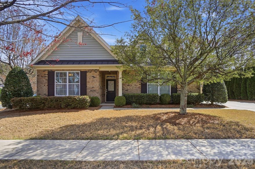 Welcome home to this beautifully maintained 1.5-story home in desirable Fort Mill, located in a community known for its top-rated schools and incredible neighborhood amenities. Residents enjoy access to pickleball court, a basketball court, resort-style pool, scenic walking trails, clubhouse, and playground. The Reserve at Gold Hill truly offers something for everyone. This move-in ready home features a thoughtfully designed open floor plan with the primary suite and a guest suite conveniently located on the main level. Upstairs, you’ll find a spacious third bedroom and a versatile bonus room perfect for a home office, media room, or playroom. Step outside to your private backyard retreat complete with a screened porch, large stamped patio, and mature trees providing shade and privacy, ideal for entertaining or relaxing evenings at home. A rare 3-car garage offers plenty of space for a golf cart, storage, or hobbies. With flexible living spaces, beautiful outdoor areas, and an unbeatable location with easy access to I-77 and Charlotte, this Fort Mill home truly has it all.