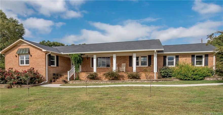 6.06 acres! Country living close to Ballantyne! Beautifully updated brick ranch w/ unfinished basement. Large heated & cooled kennel, storage bldg or workshop plus 12,500 sq of fenced back yard! 2 car side load garage. Tons of storage. Spacious sunroom w/ tile floor, skylights, ceiling fans & window seat. Chef in the family will LOVE the updated kit!  Stainless steel appliances, gas stove. Granite in kitchen & baths. Inviting covered front porch. Turn the bsmt into whatever you need! No HOA!