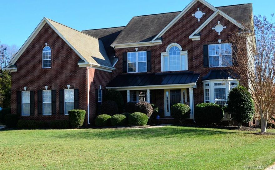 Gorgeous-tons of upgrades! Hardwood floors throughout home, tile in baths. Corian counters, SS appliances, dbl oven in huge gourmet kitchen with eat-in morning room over looking large private backyard. Crown molding and heavy trim. Grand master bedroom, trey ceiling, his/her walk-in closets, dbl vanity, whirlpool tub. Big bonus room with double closet, TV connections. Built-in speakers in Bonus rm, Master BR, Kitchen and patio. 3 full baths upstairs.  Expanded back patio, tiled front porch.