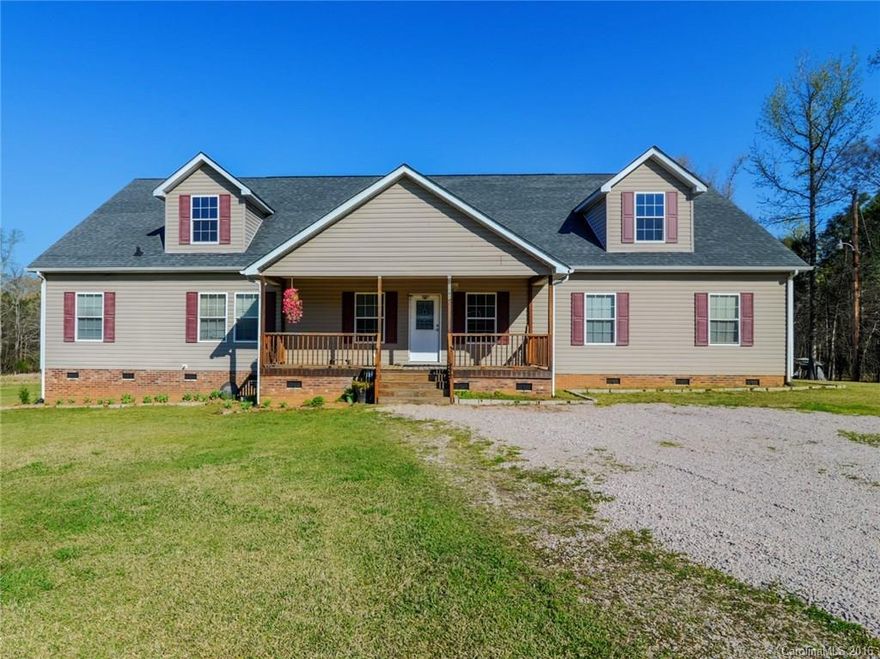 Charming 1.5 story home located on 15 acres! Extremely private lot w/ storage building out back! Enjoy the peaceful outdoors on the covered front porch or out back on the deck. Open floor plan makes for easy indoor entertaining! Gas log fireplace creates a cozy ambiance at night! Spacious master w/ serene en-suite that features his/her sinks & a garden tub. Kitchen features plenty of cabinet & counter space, Upstairs sq ftge can be finished and turned into whatever suits your needs.