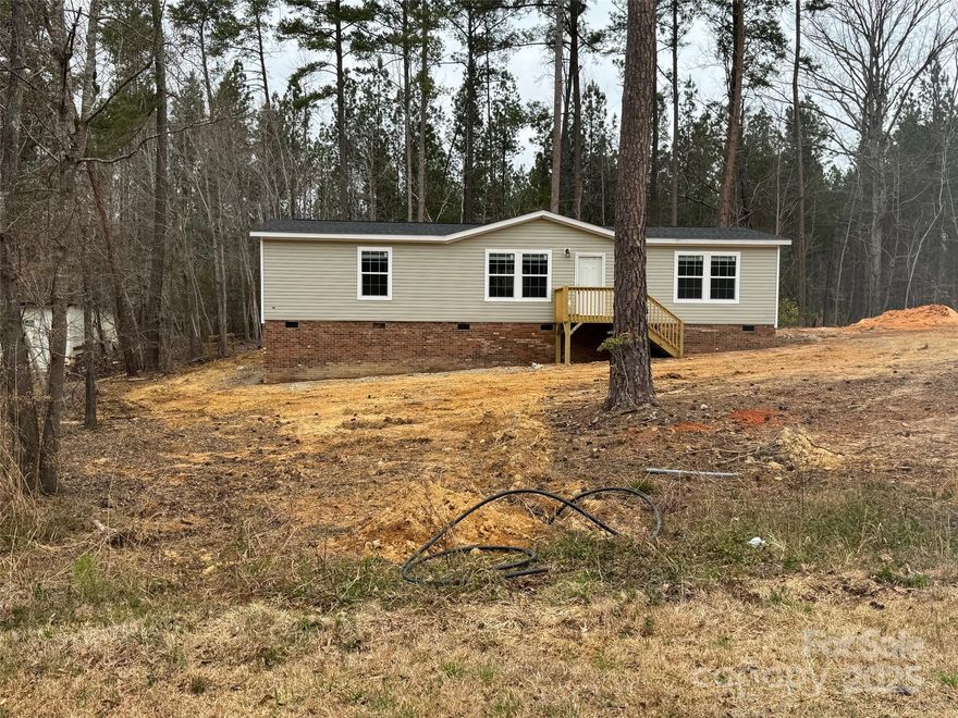 $199,900, New Home with access to Lake Tillery..an affordable Way to Enjoy Lake Tiller and The Uwharrie National Forest has to offer.  Lake in the Pines is a subsection of Carolina Forest.  The Waterfront Amenities for you to enjoy are AWESOME!!!! MEMBERS ONLY WATERSIDE CLUBHOUSE W/ POOL, BOATRAMP, PICNIC AREA, AND NOT FAR AWAY ARE THE GAMECOURTS AND PLAYGROUND.  The view from the waterfront amenities are some of the Best!  Morrow Mtn. State Park across the Lake, and the Uwharrie Mtns. next door.  This mfg home is a 2022 but never set up, or used as a model home walk through.  Coming straight off the dealer lot.
Carolina Forest is located at North End of Lake Tillery and close to the Canoe Rentals at Morrow Mtn. State.  The Uwharrie River feeds into Lake Tillery at this same area..so common to see canoes and kayakers in this area.
You will need a licensed real estate agent to access Carolina Forest, and Lake in the Pines.