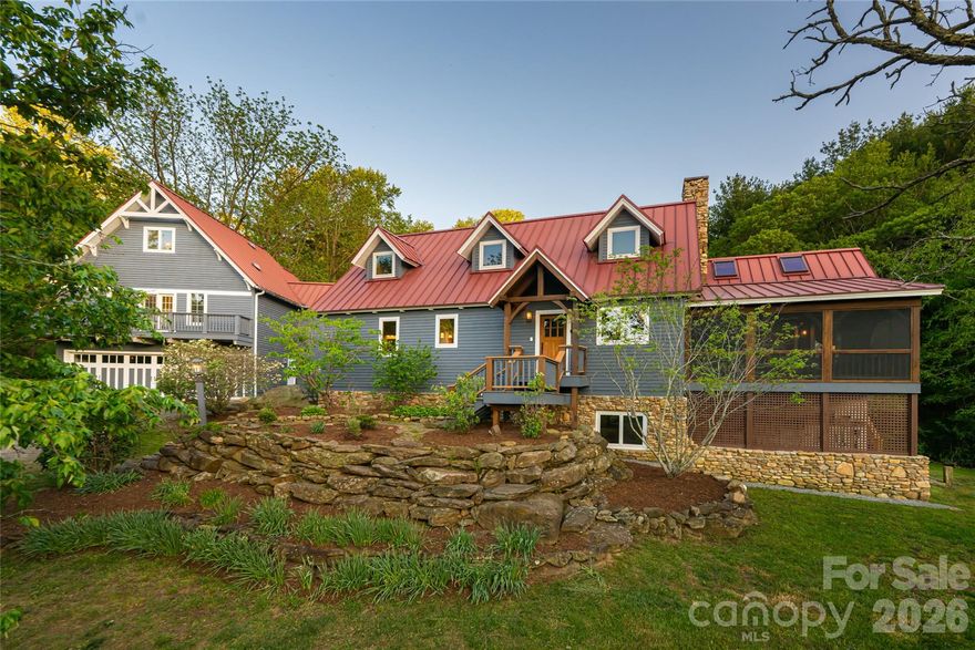 Luxury Timber Frame Estate on 20 Acres Near Asheville — Mountain Views, Creek, Geodesic Domes & Guest House.

Rarely does a property of this scope and character come to market in Western North Carolina. This one-of-a-kind timber frame estate sits on more than twenty private acres in the Reems Creek Valley in Weaverville, NC — just a short, idyllic drive from downtown Asheville — offering a remarkable combination of luxury mountain living, usable land, and income potential. With a spring-fed year-round creek, sweeping Blue Ridge views, open pasture, wooded hillside, and an extraordinary collection of structures, this is among the most distinctive properties available in Buncombe County.

The main residence is a true timber frame home with vaulted ceilings, skylights, and oak hardwood floors throughout the living areas. A stacked stone wood-burning fireplace anchors the living room, while tile floors run through the foyer, kitchen, and dining room. The kitchen features custom cabinetry, granite countertops, and a KitchenAid gas range. A screened front porch and a rear composite deck extend the living space outdoors, and the main-level primary suite opens via French doors to a private deck with an outdoor shower. The primary bath includes a jetted soaking tub, walk-in tile shower, and walk-in closet.

The upper level offers a vaulted loft and an additional bedroom with cork floors. The fully finished walkout basement includes a large recreation room, a guest bedroom with French doors to the yard, a second full bath with secondary washer/dryer hookups, and an oversized storage room with walk-in closet. A mudroom with built-ins and central vacuum add everyday practicality. The home is efficiently powered by a geothermal HVAC system and gas hot water heater, with a standing seam metal roof and freshly painted exterior completing the picture of a well-maintained mountain home.

A detached three-car garage features a fully appointed guest house above — ideal for multi-generational living, visiting guests, or short-term rental income. Two geodesic domes in the front meadow, each equipped with a mini-split system and electrical service, offer extraordinary flexibility: artist studios, wellness retreats, glamping accommodations, or additional rental income.

Whether you are searching for a luxury mountain estate near Asheville, a multi-structure property with income potential, a private retreat on acreage with a creek, or a timber frame home with guest quarters in Western North Carolina — this property is a singular answer to all of the above. A lifestyle property in the truest sense, offered in one of the most sought-after mountain communities in the Southeast.