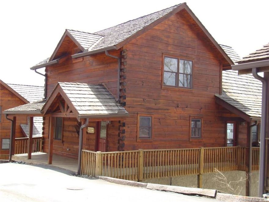 Amazing long range views from this log home perched above the clouds in Scenic Wolf Ridge. Close to ski slopes and Wolf Laurel Country Club and golf course, Open floor plan w/new wood floors on lower level in family room. 2 huge decks for entertaining, master on main level, HOA includes maintaining a community enclosed pool, shared wells and road maintenance. Great investment potential.