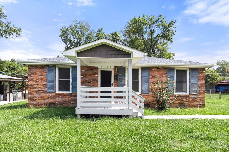 This lovely home with 3 beds & 1.5 baths is near Tipperary Pl & Shamrock Dr just a block from the Bus and less than 15 minutes from Uptown, less than 30 minutes from the Airport & has NO HOA.  New kitchen cabinets, new LVP flooring, freshly painted, partially fenced yard, and with a large welcoming covered front porch.