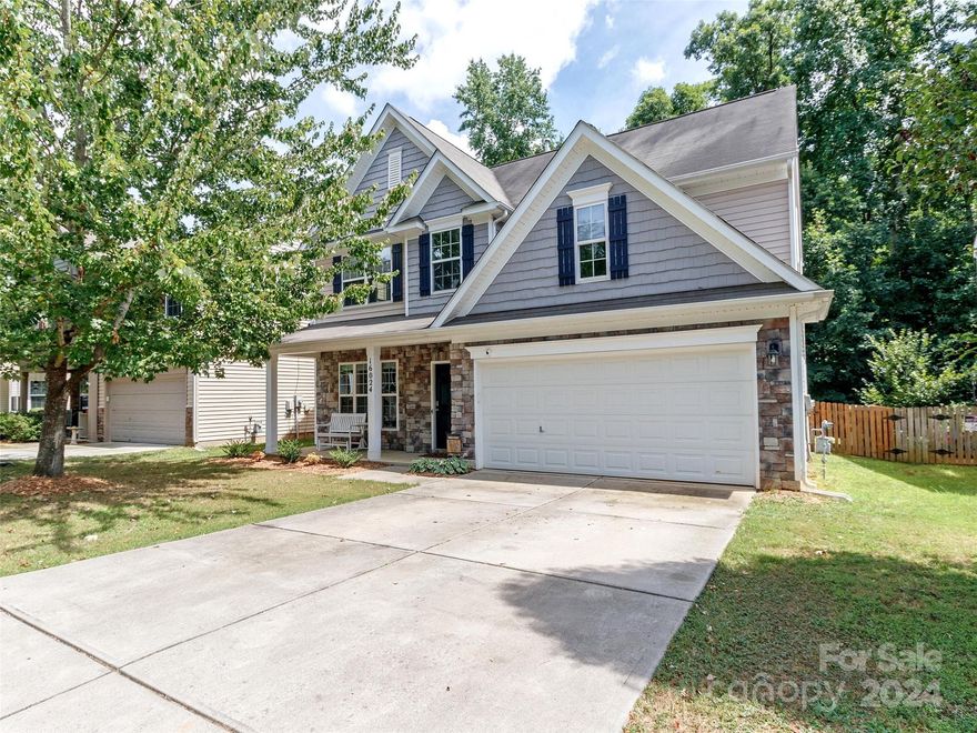 Don't miss this great 2 story home in Falcon Ridge!  Prime location for shopping, restaurants, highways, lake and airport.  Cozy front porch with stone accent & low maintenance vinyl siding.  On the main level you will find a formal dining room, kitchen that opens up to the family room with gas log fireplace.  4th bedroom down great for office or guests.  Upstairs has a loft, laundry room, 2 nicely sized guest rooms & guest bath.  Primary bedroom features vaulted ceiling, ensuite bath with separate shower & soaking tub.  Large walk in closet.  Carpet & laminate flooring is fairly new.   Outback is a large patio and deck overlooking wooded back yard.  Vegetable planters even have their own sprinkler system for easy maintenance.  Fenced in backyard is great for your furry friends.