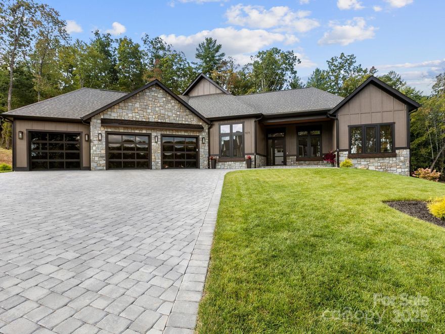 Relax and enjoy this contemporary styled 3 bedroom, 3.5 bath home in gated Horse Shoe Cove.  The floor plan is ideal for entertaining with the chefs kitchen, great room and dining space all open.  The oversized island is thoughtfully designed with a double sink and waterfall granite.  Major appliances are Thermador “energy star”. The beverage refrigerator and ice machine in the large walk in pantry are upgrades.  The primary bath has an oversized round whirlpool tub.  The walk in shower with multiple heads allows for a spa like experience. All bath rooms have heated tile floors.  The screened porch has a grilling station and an additional beverage refrigerator.  The installed hot tub off the porch allows excellent privacy on this premium lot.  Additional upgrades include the irrigation system, whole house generator, smart lighting.  The epoxy finished floor in the 3 car garage with contemporary styled garage doors complete the modern pristine look.  Horse Shoe Cove is ideally located in the beautiful rolling hills between Hendersonville, Brevard and Asheville.