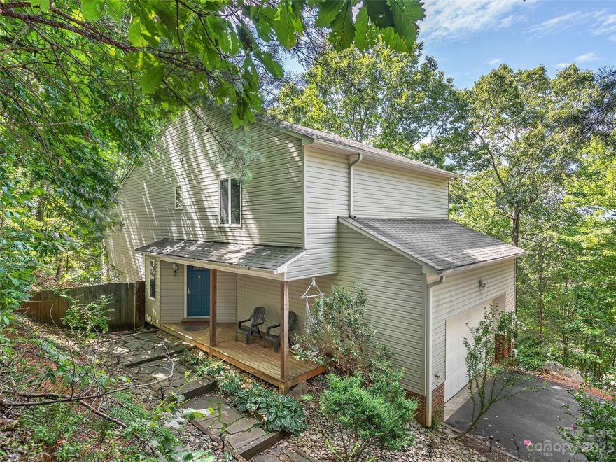 Incredible opportunity to own the perfect private mountain oasis with an income generating Airbnb. This beautiful home features hardwood floors, open concept living and dining areas, tall ceilings, and a wood burning stove in fireplace. Primary bedroom has an ensuite bathroom and walk in closet. On the main level there is a covered front porch and a large deck off the living and dining area. Downstairs is a suite for short or long term rental or multi generational living. This suite includes a spa like bath enclosed by shoji screens, and its own covered deck area.