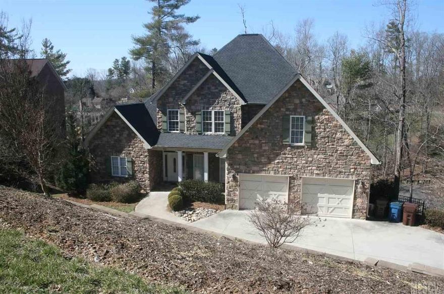 Imagine sitting on the large deck while overlooking the lake and cooking out with friends in this beautiful golf course community home.  The home has a boat slip with new stairs and a large unfinished basement to create that man cave or family space that you desire.  The main floor has a great layout with access to the deck from the master, living room and kitchen area.  The lot offers 3/4 an acre area and has a place to sit out by a fire pit with friends and family.