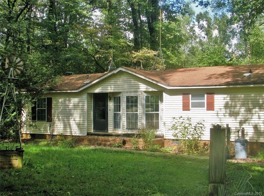 Double-wide mobile home on over 2 acres. Woodstove. Garage/workshop. Side porch/rear deck. Nice shade trees.  Property being sold as-is.  No repairs to be made.  Clover School District. Low SC taxes!!!