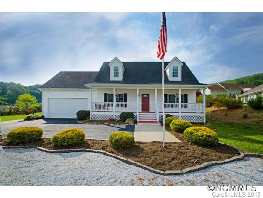 Pristine home priced to sell. Open floorplan with 10' ceilings. Newly updated. Fresh paint, all-new ss appliances, tile countertops and backsplash, lighting and kitchen faucet. Finished garage with epoxy floor. Sit on covered porch with long range mountain views and enjoy the beautiful landscaping. Home is situated on beautiful double lot w/convenient gravel turn-out. Close to shopping, medical care and Downtown Asheville.