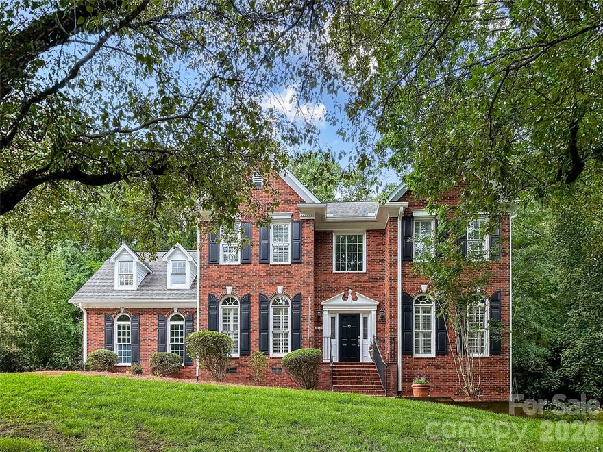 Tucked into highly sought-after Providence Plantation, this beautifully maintained 5-bedroom home simply feels like home from the moment you arrive. Warm, welcoming, and thoughtfully designed, it offers exceptional space and the versatility today’s lifestyle demands — all within one of Charlotte’s most desirable school districts.
A dramatic two-story foyer opens to light-filled living spaces, including a flexible front room perfect for a home office, sitting room, or play space, along with an inviting dining room ready for holiday gatherings and special occasions. The spacious kitchen features abundant cabinetry, a center island with gas cooktop, stainless steel appliances including refrigerator, and wall oven/microwave, all flowing effortlessly into the sunny breakfast area with bay window and an oversized family room complete with built-in bookshelves and a cozy fireplace.
Upstairs, the expansive primary suite offers a true retreat with en-suite bath with elevated finishes and two walk-in closets, while the private fifth bedroom/bonus room with full bath provides endless flexibility for guests, recreation, media space, or work-from-home needs.
The outdoor setting is what truly makes this property special. Perfectly perched on a beautifully landscaped, flat fenced lot surrounded by mature trees, the backyard was made for everyday living and unforgettable gatherings. Enjoy the expansive deck, cozy firepit area, room to play, and even space for a future pool — creating a backyard that feels both peaceful and full of possibility.
Additional updates include refinished hardwood floors, fresh interior paint, one newer HVAC system, updated gutters, and durable fiber cement siding. Located in an established swim and tennis community in the heart of South Charlotte, this move-in-ready home offers comfort, charm, and the kind of setting that’s hard to find.