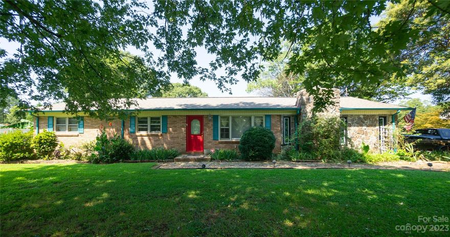 Spacious 3 bedroom/3 full bath home with in ground pool on a corner lot.  Enclosed back patio. Back yard is completely private with privacy fence. Storage building and workshop. Separate building in back yard with kitchenette and full bath, previously used as separate living quarters.