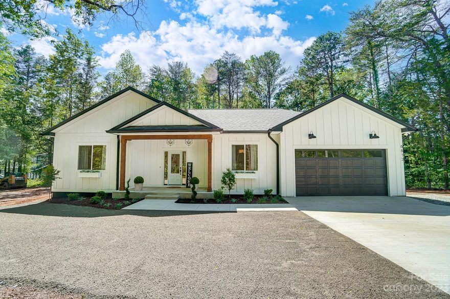 Come and see this GORGEOUS new construction home. As cozy homes are on the rise, come see this home's charm before it's gone! Located in the highly sought-after city of Waxhaw. There is NO HOA! Located in a more serene area. This home shares a street with many unique homes and cute farms. Very safe and quiet streets for you to take strolls with kids or even alone. Located on almost an acre and a half. With 10 ft ceilings, this 3 bedroom home with 2 full bathrooms is brought to you with careful thought and modern finishes in even the smallest touches. The exterior walls are built with 2x6 instead of the standard 2x4. Thicker r19 insulation in the walls and an L shaped 2- car garage with area in the back for a shop. Sure to satisfy your desire to live in the quiet country yet still be close to all of the fun that Waxhaw is reputable for.