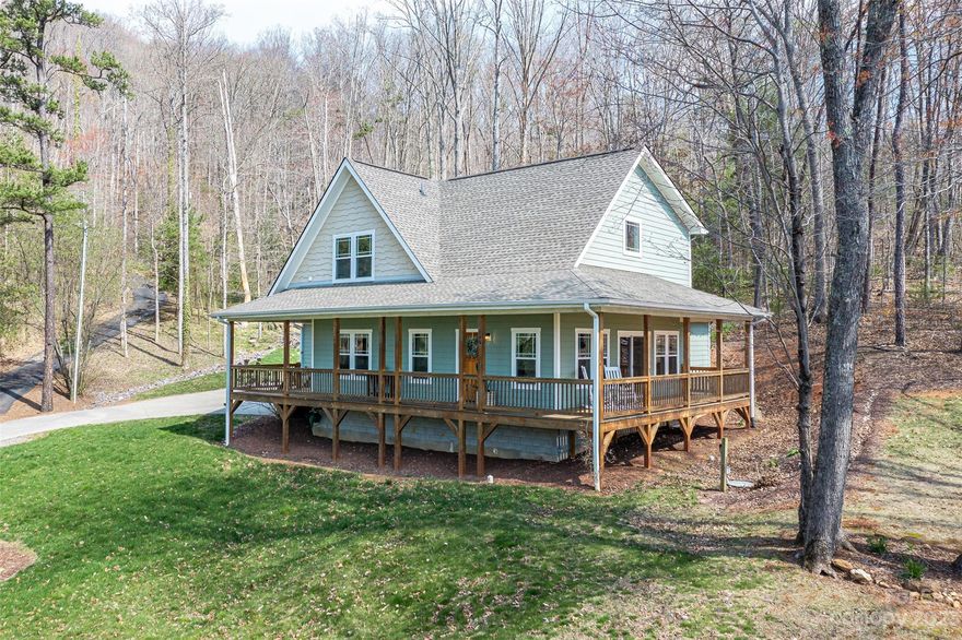 **Multiple offers received. Owners calling for best offers by 11am on Tuesday, April 18th.** Everyday lives like a vacation in this contemporary farmhouse in desirable East Asheville. Convenient to Downtown Asheville yet a world away on a private, serene wooded 0.52 acres which is a hop and a skip from the parkway and the Warren Wilson trails. This home is truly move-in ready with beautiful fit and finishes and the ease of a two-car garage. The open kitchen is an aesthetic and functional workspace as the heart of the home. Escape to the primary on main sanctuary complete with ensuite and spacious walk-in closet. Cozy up to the gas burning fireplace in the living room with cathedral tongue and groove wooden ceilings or head out into the ideal wrap-around porch and take in the winter views among the wooded property. You are sure to have a space for every purpose with the loft on the second level, two additional guest bedrooms and bonus room. Public showings begin after launch event!