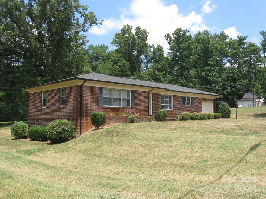This nicely maintained brick ranch home has 3 bedrooms and one bath. Most of the flooring in house is original hardwood floors. Has a gas propane furnace for heat and central air. The property includes 2 .22 acres + or - with a separate apartment and barn. The apartment is a separate structure and has one bed, one bath, kitchen and living area. Under the apartment is plenty of storage or additional garage parking.  The barn was used as workshop and has lots of room for storage. The land is mostly flat and has a good area for garden space. Water source is county hook up but there are two wells on property.
