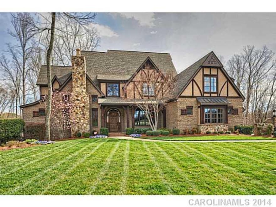 Gorgeous Tudor style brick home rests on .63 acres and backs up to natural preserve for perfect privacy. Custom built home incl. 4 fireplaces and countless upgrades. Spacious MBed. Gourmet kitchen w/Viking appl, built-in Miele coffee/espresso machine and granite counter tops. Lower level has kitchen/bar, media and rec area...perfect for entertaining! Possible in-law suite lower level, handicap assessable opportunities.  Salt water pool/hot tub and multi-sport court.