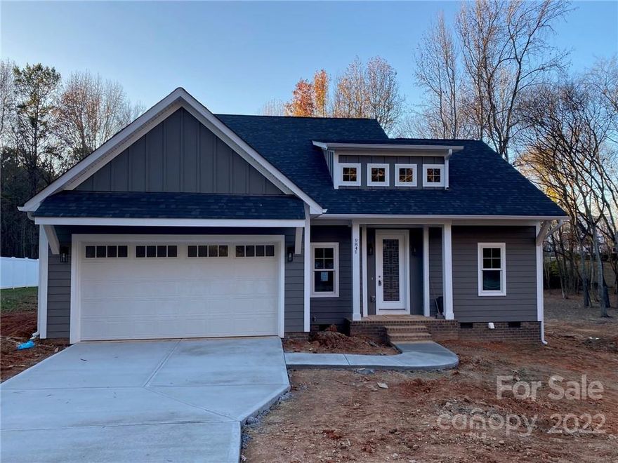 Great 4 bedroom, 2.5 bath home boasting 1957 SQ' of HLA on a 0.37 acre lot. This modern farmhouse cottage, handcrafted by JM Johnson Construction, has fantastic finishings at an accessible price point. The open floor plan features the owner's retreat on the main level w/ a spacious bath including double closets. The gourmet kitchen includes soft close cabinets/drawers, granite countertops, tile backsplash, stainless appliances including the refrigerator, and a large island. You'll enjoy the stylish light fixtures, ceiling fans in all of the bedrooms, LVP flooring throughout the majority of the main level w/ carpet on the upper level, & tile flooring & surrounds in both full bathrooms. The owner's bath has a large tile shower and the upper level bath has a tub/shower combo. The garage entry connects to the laundry room. The exterior is fiber cement siding w/ Anderson windows. Located close to shopping & dining options @ Exit 25 & Birkdale.