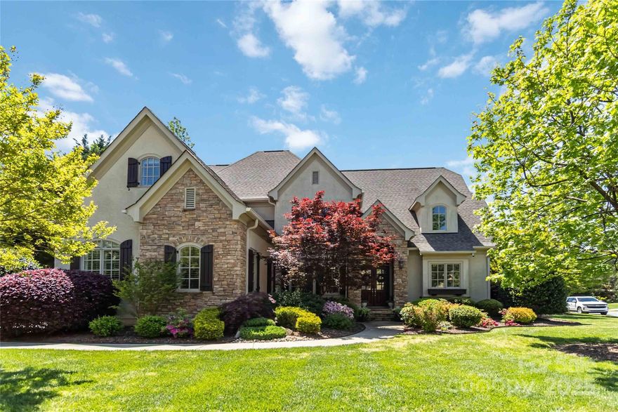 Stunning custom home in sought-after Kingsmead with elegant design and exceptional functionality. Features include hardwood floors, heavy trim, plantation shutters, coffered/trey ceilings, and custom built-ins. Main-level primary suite (14x28) boasts a luxurious bath and oversized custom walk-in closet. Gourmet kitchen with granite island, double ovens, butler’s pantry, and large dining room flows into keeping and breakfast rooms—ideal for entertaining. Offers 5 bedrooms, each with private bath and walk-in closet, plus 2 half baths. Bonus room (16x42) with sink and storage, walk-in attic, 2nd floor homework loft, 3rd floor office, exercise room with ½ bath. 3-car garage with built-ins, central vac, hot/cold water for pets/cars. Screened porch with built-in speakers overlooks oversized patio, built-in grill, and private fenced yard with room for pool. Top-rated Marvin schools!