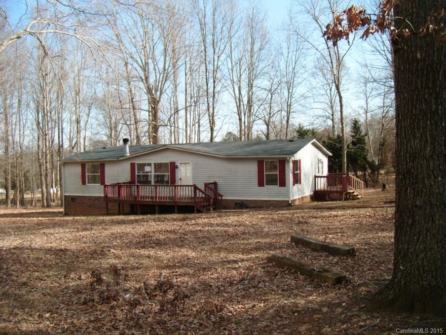 Fixer-upper,  .8 wooded acres 3 bedroom/2 bathroom Mfrd. home 1994--1404s.f.back deck.  Sold AS-IS. Fix-ups can be financed $100 down fin.g possible. Ask agent for details.  utilities off at property.  See agent remarks for bidding instructions.  Case #   381-880534 "EQUAL HOUSING OPPORTUNITY"