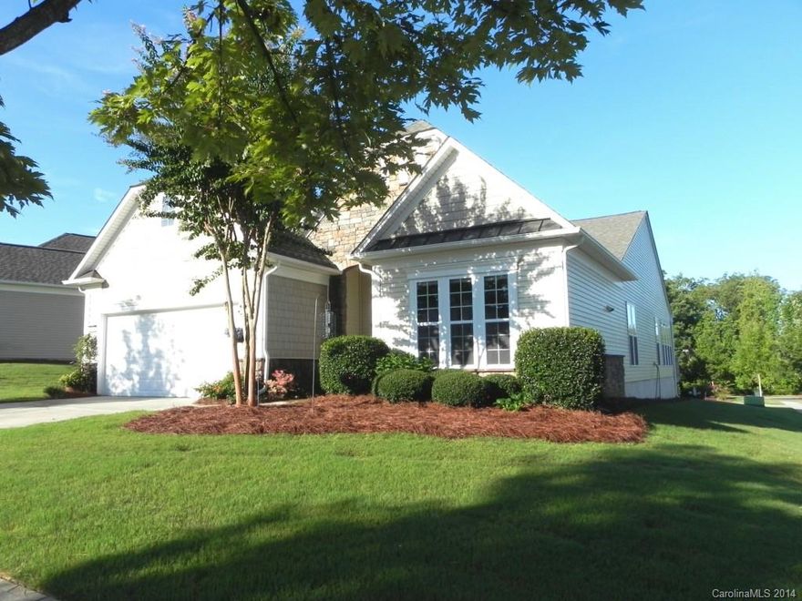 This 2BR/2BA Willow Bend with a sunroom sits on a corner lot.  It features a four burner smooth top stainless stove, French door refrigerator, granite counters, backsplash, pull-out cabinets and recessed lighting.   Light oak hardwoods, ceramic tile in the baths and carpeting in the bedrooms.  Ceiling fans, shades and plantation shutters in the bright sunroom.  Come check out the community and the active adult lifestyle of Sun City Carolina Lakes.