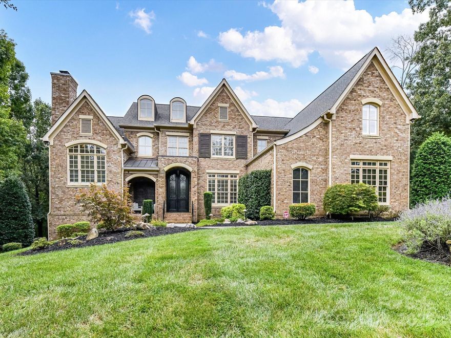 Welcome to this stunning 5-bedroom, 5.5-bath estate that blends timeless elegance with modern comfort. The main level boasts the primary suite with a spa-like ensuite and a grand great room anchored by a beautiful fireplace. A formal living room with its own fireplace adds warmth and charm, while the large kitchen impresses with granite counters, ample storage, and stainless appliances. The private office, located off the landing between the first and second floors, features a cozy fireplace and offers the perfect quiet retreat. Upstairs, you’ll find three spacious bedrooms, each with an attached bath, plus a dedicated theater room. The finished basement expands the living space with a bedroom and full bath, a recreation room with wet bar, and a heated garage area that includes a second rec room. Step outside to your private retreat featuring an inground pool with spa and tanning ledge, extensive patio space, and a fully fenced backyard for added privacy. This home is designed for both everyday living and unforgettable entertaining.