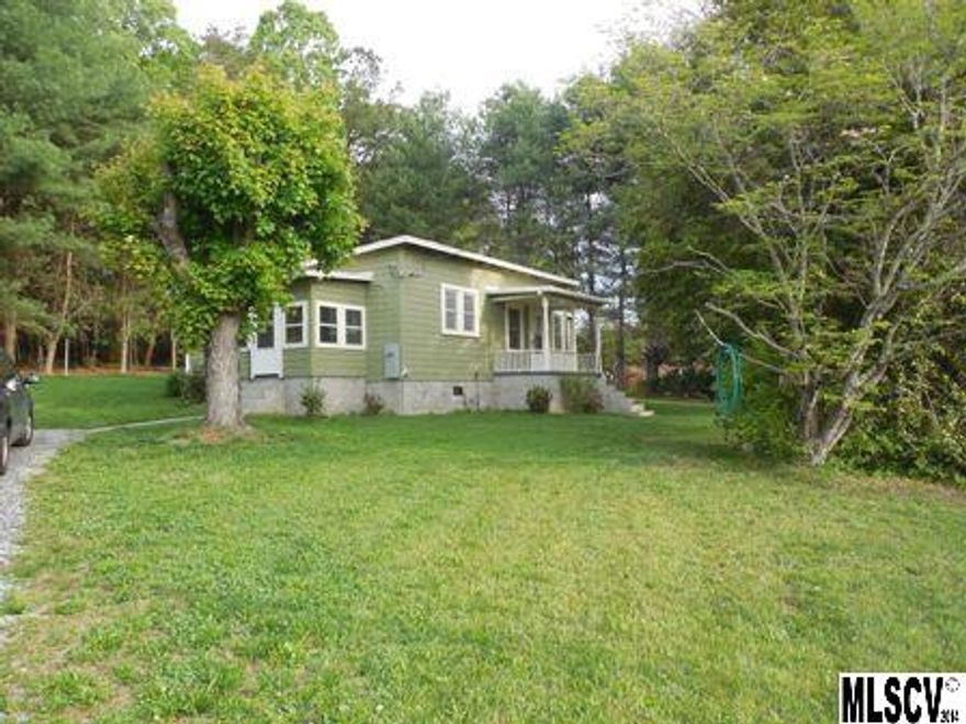 TURN-KEY! Adorable 2 Bedroom bungalow on 1/2 acre looks brand new! New roof, new heat pump/central air, new window replacements, new paint and refinished hardwoods throughout the entire house with the exception of linoleum in bathroom! Huge kitchen has plenty of cabinets, brand new counter tops and appliances! Extra large bedrooms each have private access to bathroom. Nice enclosed porch and utility room...Spacious storage room will accommodate all your garden and lawn tools! Level yard has room for a garden and borders woods.