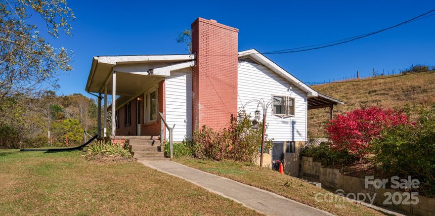 SOLID BRICK RANCHER AND NUMEROUS BARNS SITUATED ON 14.52 FENCED IN, MOSTLY CLEARED ACRES WITH A CREEK WITHIN A FEW MINUTES OF DOWNTOWN WEAVERVILLE AND ABOUT 15-20 MINUTES TO DOWNTOWN ASHEVILLE. GREAT PROPERTY FOR CATTLE, HORSES, MINI FARM, ESTATE, AND POSSIBLE DEVELOPMENT. YEAR ROUND LONG RANGE VIEWS FRO THE TOP OF THE PROPERTY. PROPERTY SOLD AS-IS