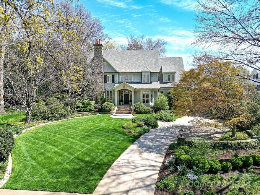 This grand Eastover home offers a lovely balance of comfort and elegance on a beautiful 1/2 acre lot.  You'll find high end finishes and premium materials throughout the inviting floor plan with spacious rooms, soaring ceilings and beautiful wide, heart of pine floors (rumored to be from a Hershey's plant). Five large bedrooms with primary suite on main, and 2 offices, one up, one down. In the heart of the 2nd floor is a space the seller's three girls used for homework - with a large table in the middle and shelving on both sides, it could be an art/craft room, study space or another office. Expansive bonus room and exercise room on 3rd floor along with copious amounts of walk in storage. Room above the garage is floored with windows and electricity, no HVAC but offers even more storage.  A screened porch off the family room overlooks the beautifully landscaped, fenced in back yard. Lovely rose garden by the friend's side entrance. This home is an Eastover gem.