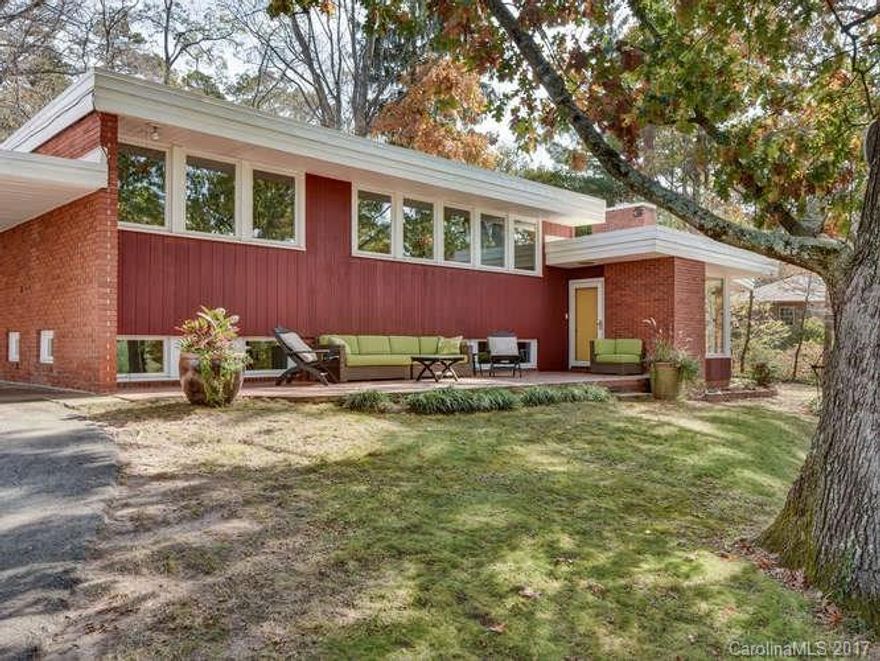 Rare opportunity to own this one-of-a-kind, mid-century modern home by notable architect Bert King located in the desirable Grove Park neighborhood of North Asheville. Great architectural lines on the exterior with versatile spaces on the interior. 3 Bedrooms Upstairs with 2 Bonus Rooms Down. Family Room. Recently updated kitchen and new composition roof. Sits privately above the street on a generous lot. 2 car carport. This one is both ready-to-go or ready for your updates.